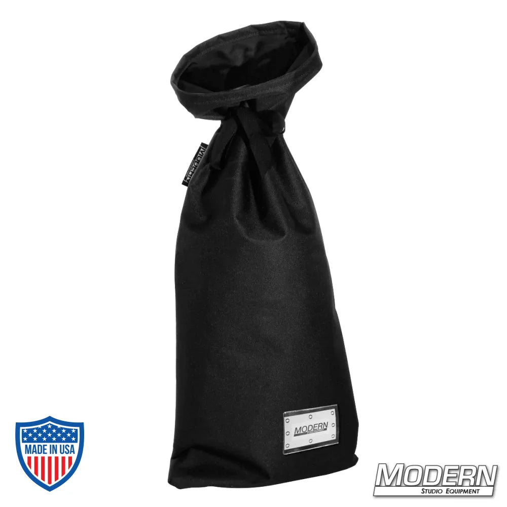 Small black storage bag with nylon cord for tying, plastic sleeve for labeling, ideal for overheads, textiles, film grip, and rigging.