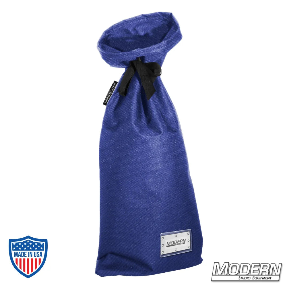 Blue small storage bag for film grip rigging with nylon cord for tying and plastic labeling sleeve on bottom, 12" wide, 27" long