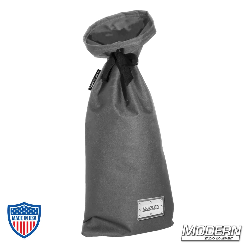 Small storage bag for film grip rigging with nylon cord tie and plastic labeling sleeve, 12"es wide at base, 27"es long.