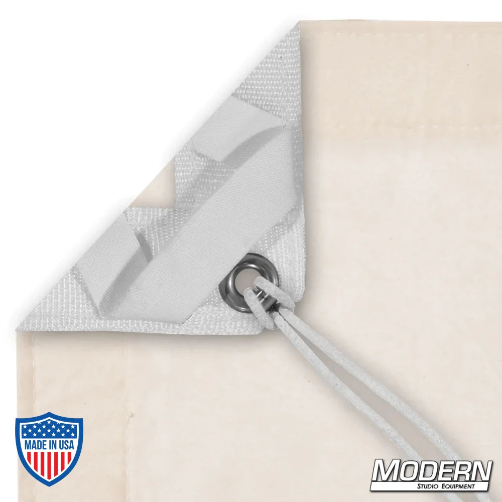 Unbleached Muslin overhead with grommet and elastic corner for film grip rigging, includes storage bag labeled with contents.