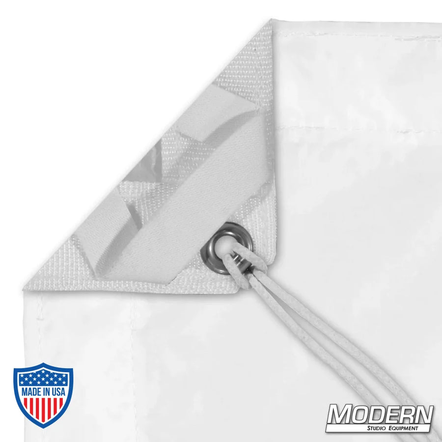 Close-up image of white artificial silk with grommet and tie, used in film grip and rigging, with Modern Studio Equipment branding.