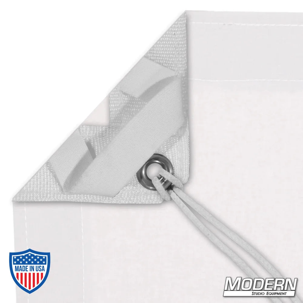 White blackout textile with grommets and ties for film grip rigging, includes storage bag. Opaque and blocks 110% of light.