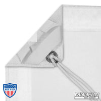 White single scrim with elastic corner and grommet for film grip rigging, includes storage bag for light reduction without altering color.