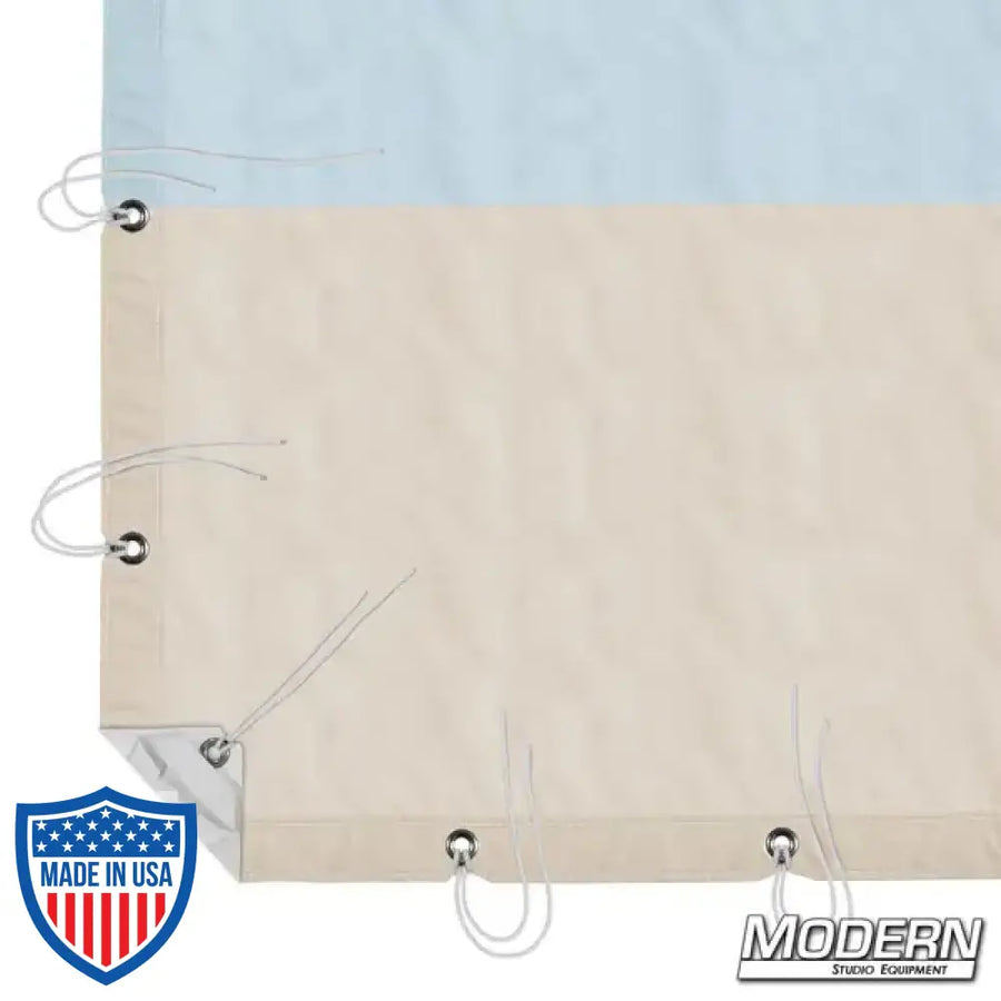 12' x 12' Natural Bounce muslin with sky blue and beige sections, webbing, grommets, and ties, for film grip and rigging, with storage bag.