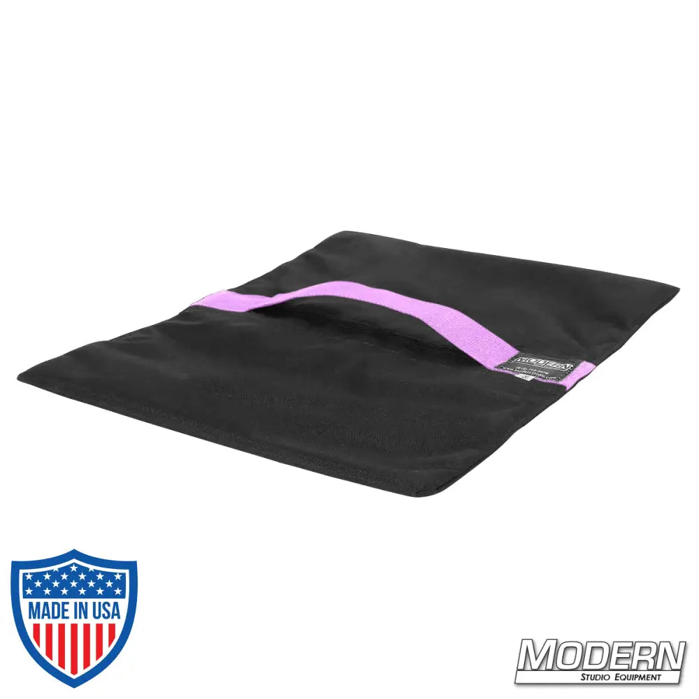 Flyaway sandbag for film grip and rigging, made with durable Cordura 1000, featuring a velcro closure, 15 lbs capacity, empty, black with purple stripe