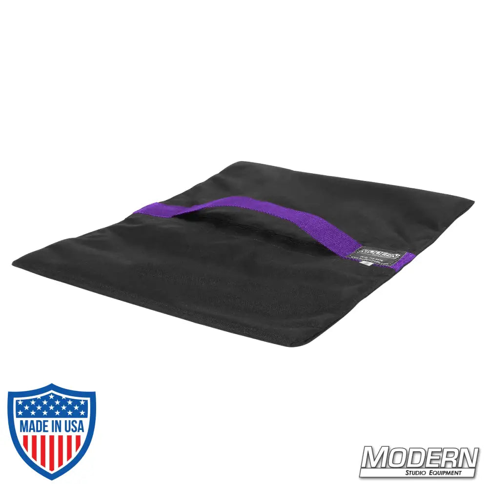 Flyaway sandbag 20 lbs, black with purple strap, Cordura 1000, velcro closure for easy fill, ideal for film grip rigging tasks.