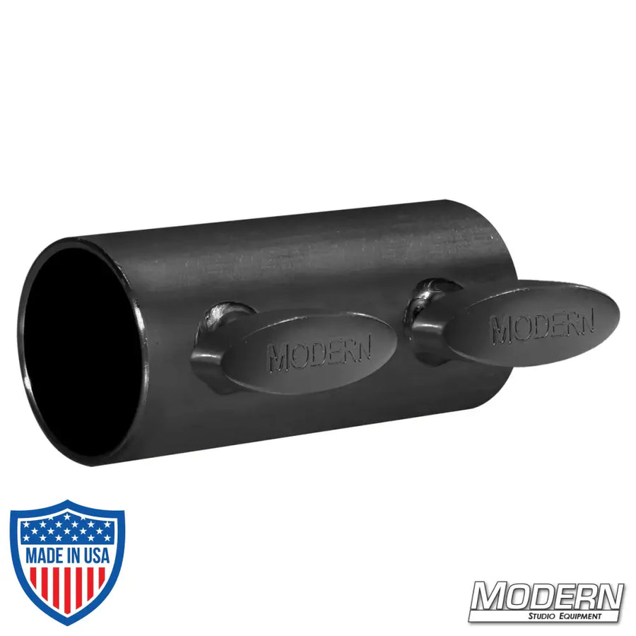 Black zinc short sleeve coupler with T-handles for joining 1-1/4" Speed-Rail®, ideal for film grip and rigging setups.