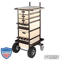 Steel grip cart for film rigging with 3 small and 3 large wooden drawers, fixed rear casters, and front swiveling, braked casters.