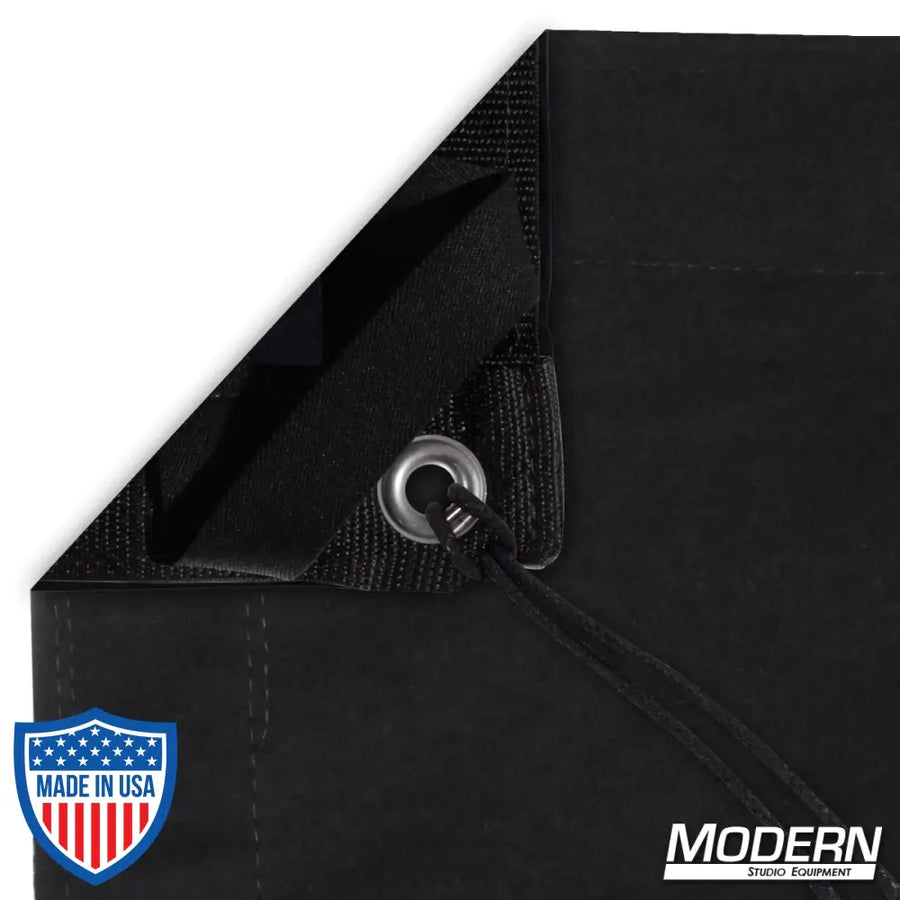 Solid black slip cover with bag showing webbing, grommets, ties, and elastic corners for film grip rigging, blocks 100% light.