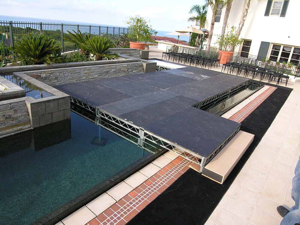 Steel deck platform over pool setup showcasing versatility, strength, and ease of use for film production and rigging applications.