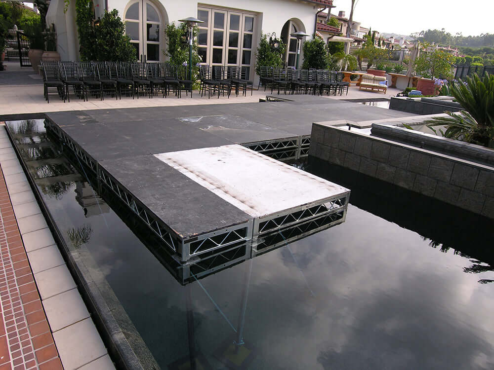 Steel Deck platform over water used for film grip rigging at outdoor event venue