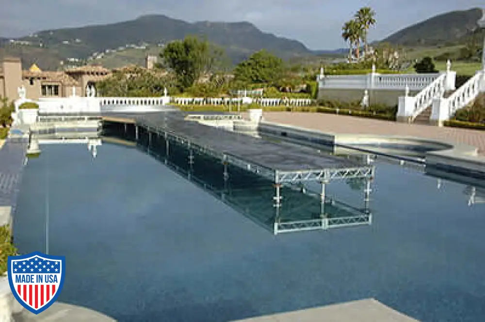 Steel deck platform over a pool with scenic mountain view in the background. Ideal for film grip and rigging needs.