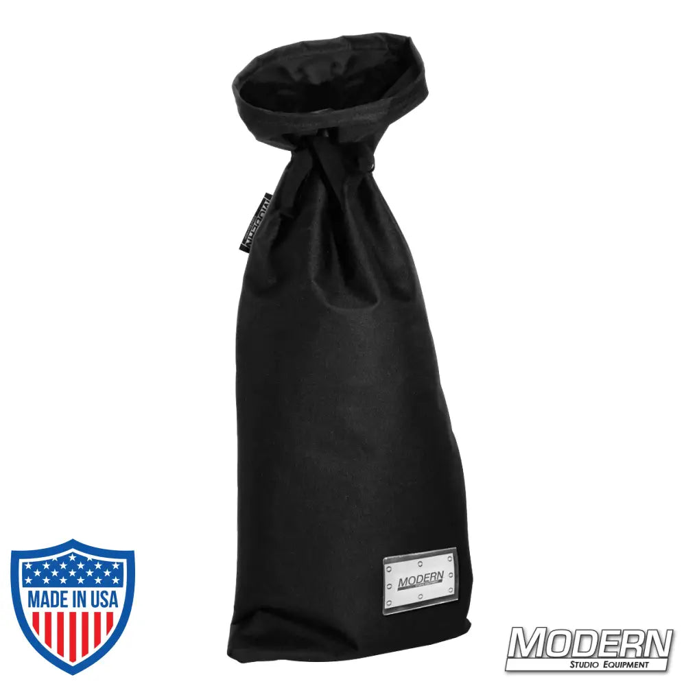 Medium black storage bag with nylon cord for secure tying, ideal for film, grip, and rigging use. Features a plastic sleeve for labeling.