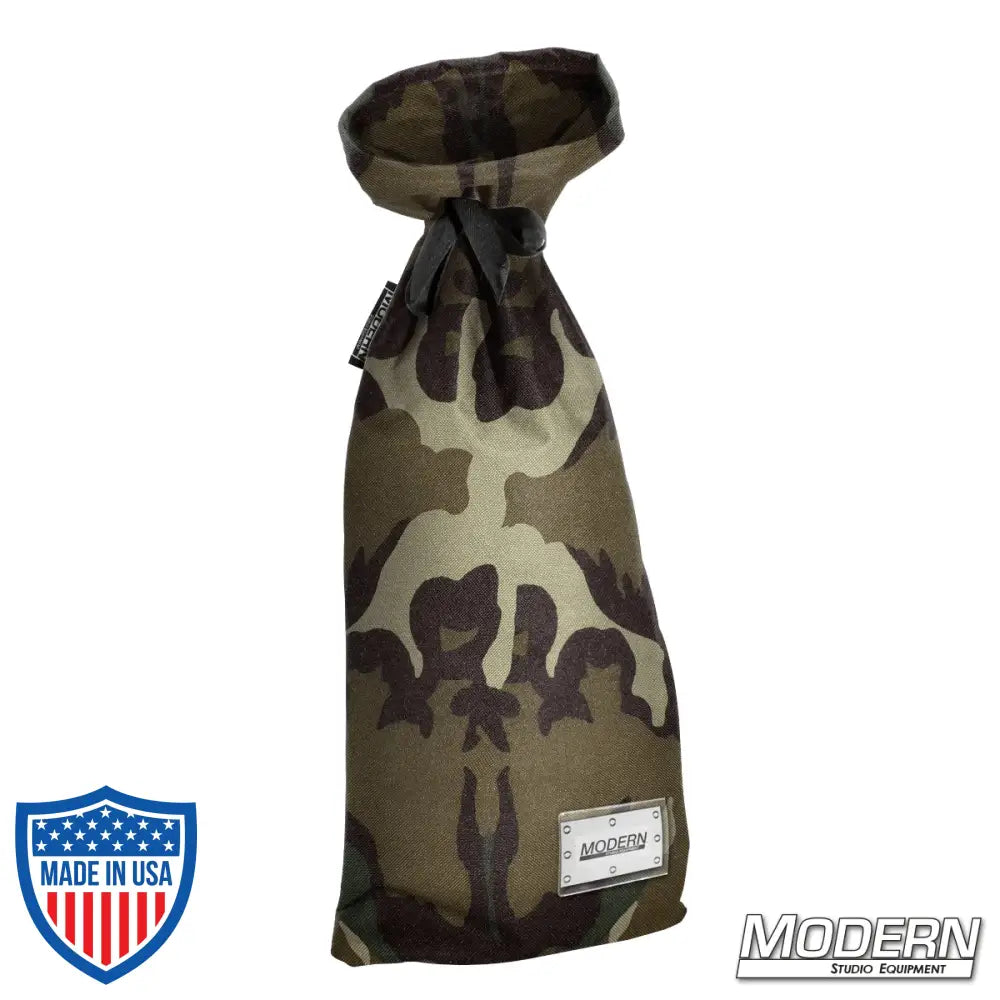 Camouflage storage bag with nylon cord and plastic labeling sleeve, ideal for film grip and rigging equipment, 14 inches wide, 34 inches long.