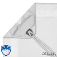 White single scrim with elastic corner and grommet for film grip rigging, includes storage bag for light reduction without altering color.