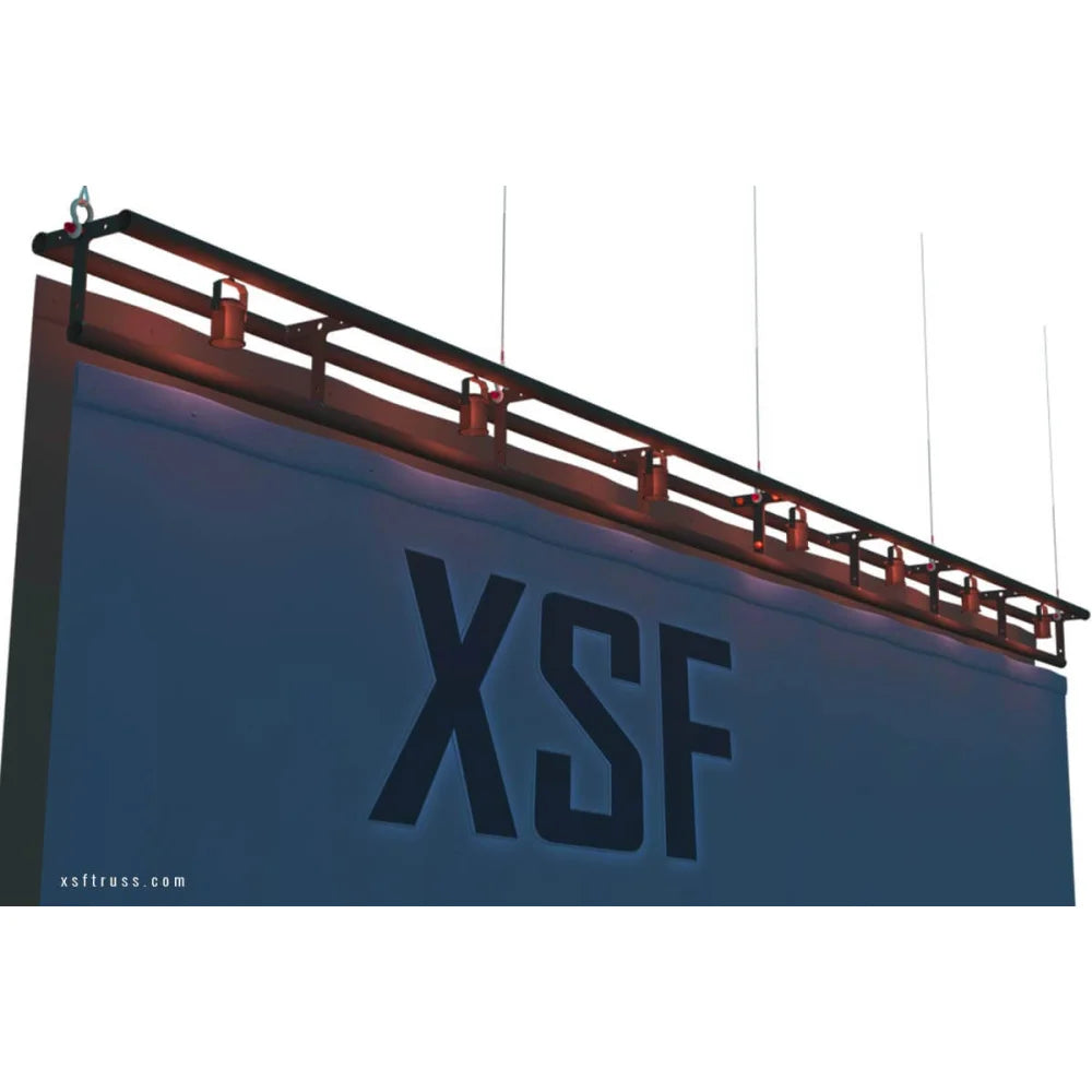 XSF 12" T-Batten Truss mounted above stage backdrop for grip and rigging in film and entertainment settings