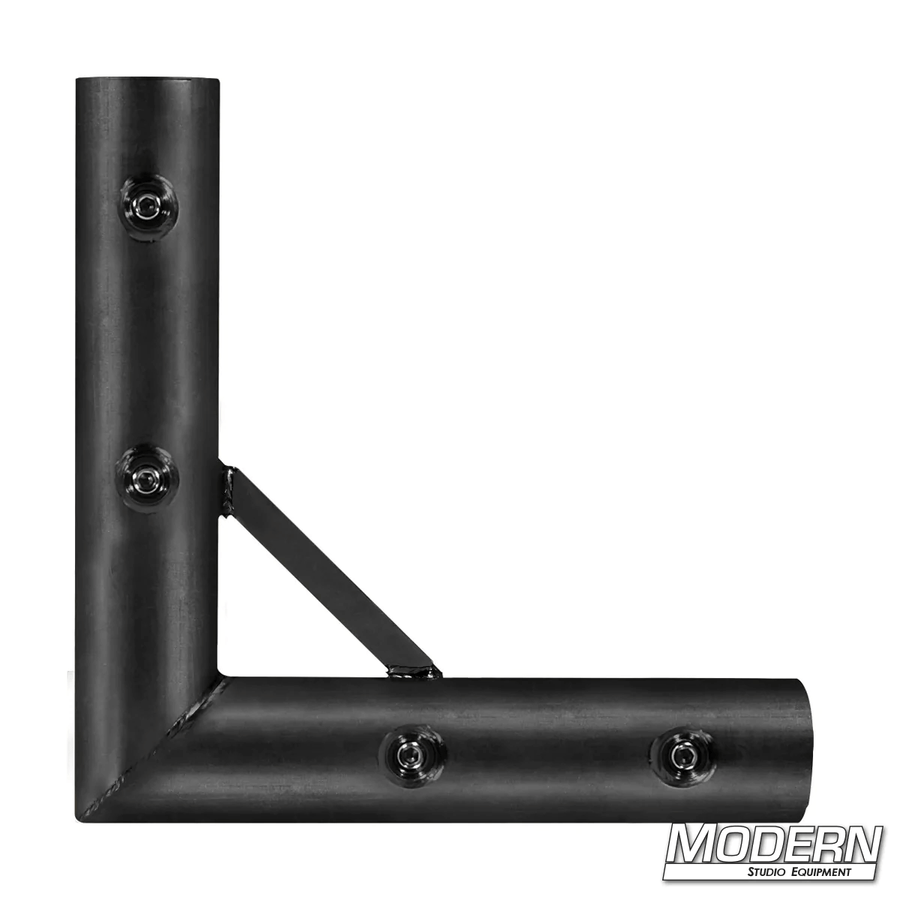 Black zinc 1-1/4-inch Speed-Rail® corner fitting for film grip and rigging with set screws.