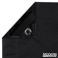 Solid black slip cover with bag showing webbing, grommets, ties, and elastic corners for film grip rigging, blocks 100% light.