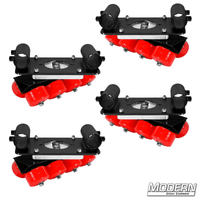 Set of four black zinc skateboard wheel speed-rail brackets with red wheels for film grip rigging setups.