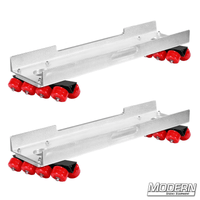 Skateboard dolly complete with channels and 32 red soft durometer wheels for film grip and rigging use on track.