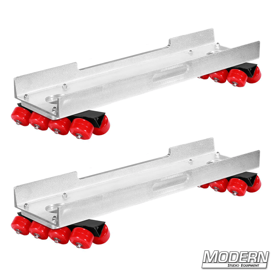 Skateboard dolly complete with channels and 32 red soft durometer wheels for film grip and rigging use on track.