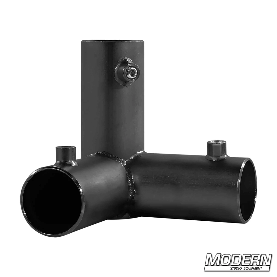 Black zinc 3-way pass through corner fitting for 1-1/2 inch Speed-Rail®, used for film grip rigging.