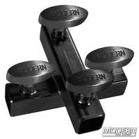 Black zinc cross fitting for 1-inch square tube with T-handles, used for 90º aluminum connections in film grip rigging.