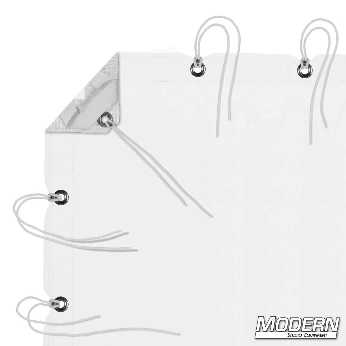 White Artificial 1/4 Stop Silk with webbing, grommets, ties, and elastic corners for film grip rigging. Includes storage bag.