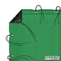 Chromakey green screen textile with grommets, webbing, ties, and sewn elastic corners, ideal for film grip and rigging, includes storage bag.